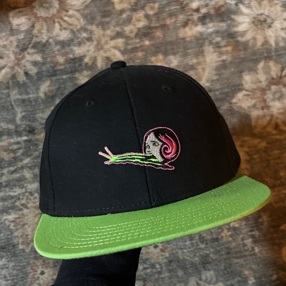 Black and Green Cap with Snail Design